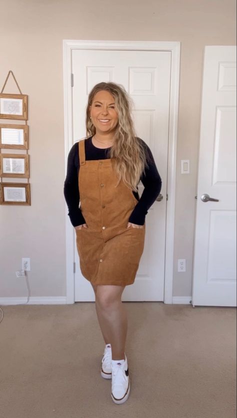 Black long sleeve shirt under a brown corduroy dress. White Nike sneakers. Teacher Thanksgiving Outfits, Corduroy Overall Dress Outfit Fall, Courdory Overalls Outfits, Corduroy Dress Outfit Fall, Courdory Dress Outfit, Overall Dress Outfit Fall, Overall Dress Outfit Winter, Corduroy Jumper Outfit, Brown Overalls Outfits