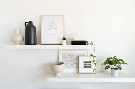 Neutral minimal black white and wood office decor ideas and inspiration. White floating shelf above desk decor with a pop of greenery. Minimalist vases complete the look with inspirational art prints. #officedecor Black White And Wood Office, Floating Shelves Above Desk, Office Floating Shelves, Wood Office Decor, Shelves Above Desk, Minimalist Shelves Decor, Above Desk, Ikea Lack Shelves, Ikea Regal