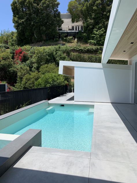 Exterior Concrete - Special White/Grey mix then stained  in a light grey color Stained Concrete Around Pool Ideas, Brushed Concrete Pool Deck, Pool Deck Ideas Inground, Pool Decking Concrete, Concrete Pool Deck, Pool Paving, Pool Decking, Concrete Swimming Pool, Pool Pavers