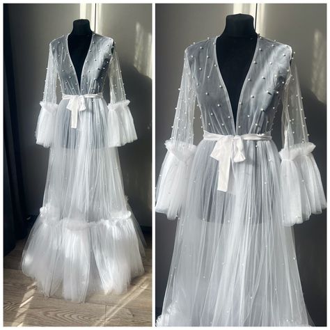 This is the gorgeous, beautiful robe Very pleasant to the body. Delicate dress for the perfect morning of the bride. We also have nightgowns and pajamas that you can wear under a robe https://www.etsy.com/shop/SavchenkoDesign?ref=seller-platform-mcnav§ion_id=41256169 If you can't find the information you need or need some advice for your design? Feel free to contact us. We are fast to reply :) Pregnancy Gown, Delicate Dress, Maternity Photoshoot Outfits, Wedding Robes, Perfect Morning, Bridal Robe, Wedding Robe, Pearl Dress, Maternity Gowns