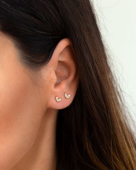 "Tiny and dainty little studs featuring two shiny leaf shaped zirconia gemstones for the most understated sparkle. These classy and simple studs are perfect for wearing in a first or second hole piercing as well as cartilage piercings. * D E T A I L S * ∙ Sold as a PAIR ∙ Material:  .925 Sterling Silver or 18K Gold Plated over .925 Sterling Silver  ∙ Stone: Turquoise, Emerald Green or White cubic zirconia stones ∙ Dimensions:  5mm ∙ Come with butterfly backs ∙ Hypoallergenic & nickel-free * P A Small White Stone Earrings Gold, Second Stud Earrings Gold, 2nd Ear Piercing, Turquoise Earrings Gold, Minimalist Ear Piercings, Ear Piercing Studs, Tiny Gold Studs, Dainty Gold Earrings, Huggie Earrings Silver