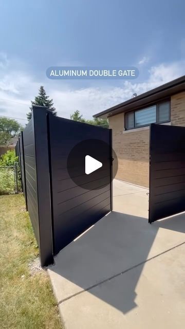 Greenwood Fence™ | Composite + Aluminum on Instagram: "Smooth + good looking, tell your contractor you need a Greenwood Fence aluminum double gate.👇🏼 Do you like this style fence? Comment below. 📍Greenwood Fence HQ — Elmhurst, IL 🛠️: USA only shipping 🎥: @modern_fence_chicago #GreenwoodFence #compositefence #modernfence #privacyfence #DIYfence #aluminum [local fence builder, old post removal, concrete posts, backyard decor, luxury backyard, composite fencing, composite materials, gates, custom gates, aluminum gates, double door gate, wood plastic composite, fencing, fence build, custom fences, home improvement, luxury home ideas]" Composite Gate Ideas, Aluminum Gates Design, Fence Front Yard Ideas, Gate Fence Ideas, Front Gate Design Front Gate Design Modern, Double Gate Fence, Fences And Gates Modern, Modern Fences And Gates, Composite Fence Ideas