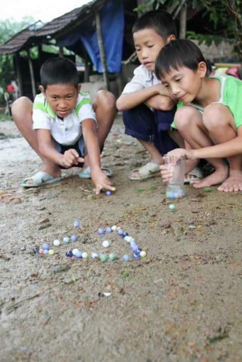 games from around the world -- marbles Games From Around The World, Childhood Photography, Childhood Memories Art, Harmony Day, International Games, World Vision, Operation Christmas, Art Village, World Party