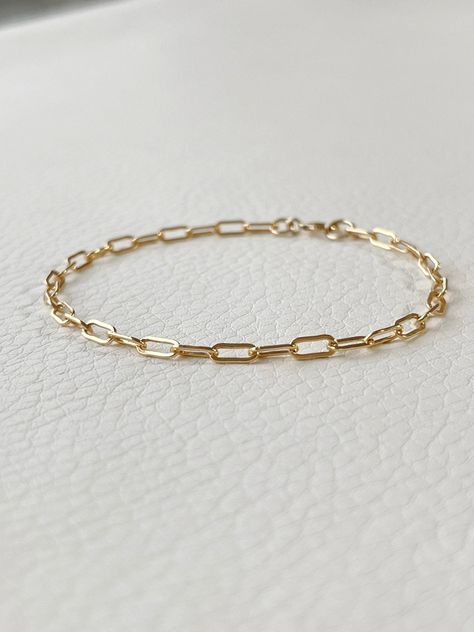 - Handmade in USA - 14k Gold Filled Paperclip Chain - 14k Gold Filled Spring Ring Clasp - Can Be Gift Wrapped PRODUCT INFO Small paperclip 14k gold filled chain bracelet or anklet. Super flattering on anyone and can be personalized with different charms and lengths. Choose between a flower, heart, lightning bolt or star before you choose your length and checkout. Also choose if you would like your charm attached to the chain or floating on it. CARE INSTRUCTIONS Treat the chain well and it will k Hoco Freshman, Heart Lightning, Homecoming Inspo, Garnet Bead Bracelet, Stretchy Rings, Greenwich Ct, Crescent Moon Necklace, Homemade Jewelry, Pink Necklace