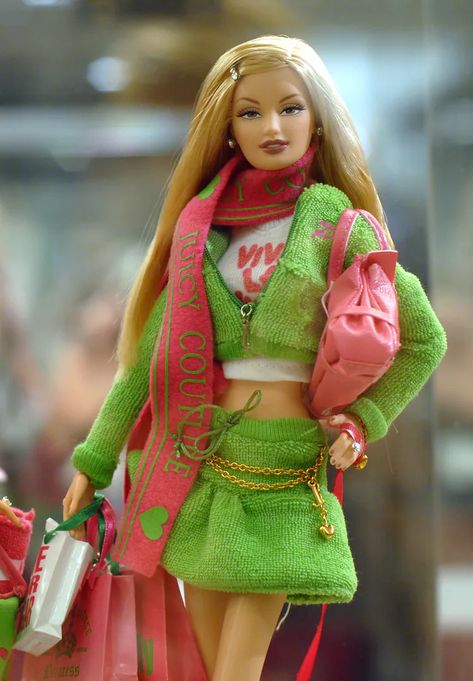 A Barbie doll wearing Juicy Couture is displayed at Bloomingdale’s 59th Street to celebrate Barbie’s 50th anniversary on February 12, 2009 in New York City. #barbie #doll #barbiedoll #barbiecore Barbie Collaboration, Barbie Convention, Vera Wang Gowns, Christian Dior Designer, Sequin Bra, Alexander Mcqueen Clothing, W Magazine, Membership Card, Couture Designers