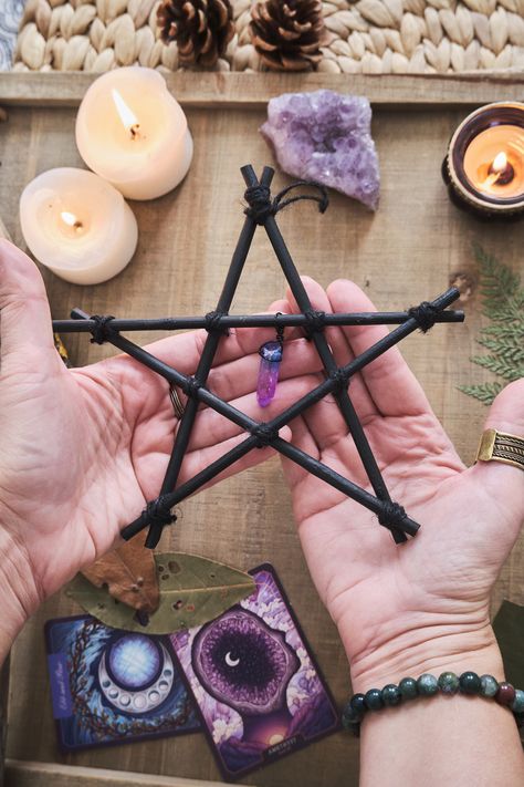 This Wood Pentagram in black, adorned with a  with Crystal, could be the perfect little Samhain decor for your Altar Space or your Home! This pretty pentagram was created with branches from the Laurisilva Forest which I have handpicked myself and painted black. The branches are fastened using jute string, and decorated with a beautiful Aura Quartz crystal, which gives it an extra magical touch, and you can choose between several options. This piece will not only give add some witch vibes to your Wicca Altar Ideas, Wiccan Decor Diy, Witch Diy Decoration, Witchy Diy Decor, Diy Witch Decor, Witchy Decor Witch Cottage, Witch Crafts Diy, Witch Diy Crafts, Pagan Christmas Decorations