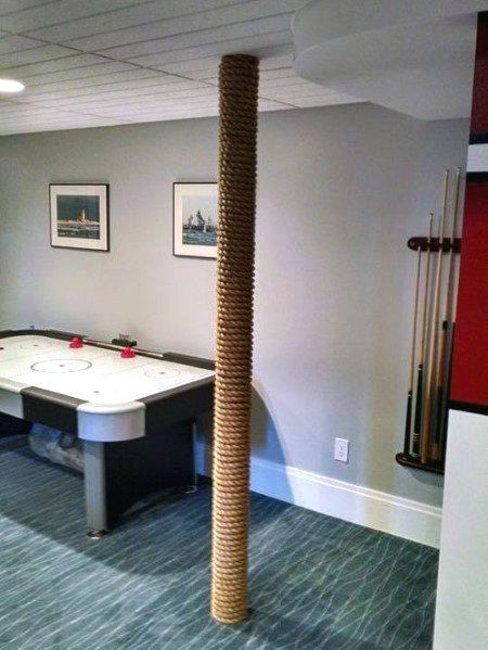 Discover how to hide unsightly support beams and steel posts with the top 50 best basement pole ideas. Explore unique downstair column cover designs. Basement Pole Wrap, Basement Pole Ideas, Basement Pole Covers, Basement Poles, Small Basement Remodel, Column Covers, Basement Inspiration, Diy Basement, Waterproofing Basement