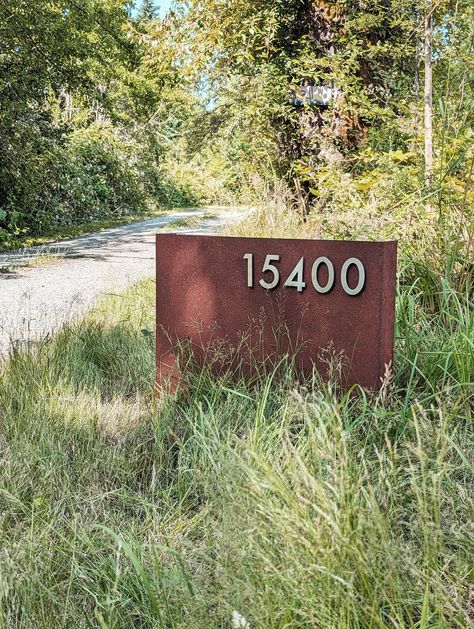 Our custom Rural Address signs are a must for your country driveway. The single piece of 12-gauge steel comes in a weathered patina, with floating 3.5" stainless steel magnetic letters and numbers that makes your address easy for guests to spot. Built to last for decades, our signs welcome you home. Installation: Typically the signs are buried 6-8 inches into the ground, depending on the soil type. Metal Yard Signs Outdoor, House Number Sign For Yard Driveways, Ranch Signs Entrance, Driveway Decor, Country Driveway, Circle Driveway, Driveway Sign, Modern Driveway, Address Marker