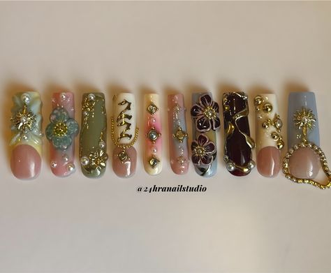 Your favorite nail tech turned 22✨🌸☀️✨ Custom birthday set for myself @zahrazshahh Here’s a rundown of the inspiration behind this set: Zahra in Arabic means flower so i based it around 3D flowers, I was born on the summer solstice so i added some gold sun charms, and my birth stone is a pearl so i added a few for embellishment. Everything is hand sculpted and painted by me ✨ #njnailtech #bestofnjbeauty #njnails #gelxnails #custompressons #custombirthdaynails #birthdaynails #nycnails #n... Long Junk Nails With Charms, Gold Nail Charms, 22 Nails Birthday, Nails With Numbers On Them, Nail Page Name Ideas, Cute Nails With Charms, Nail With Charms, Arabic Nails, Gold Charm Nails