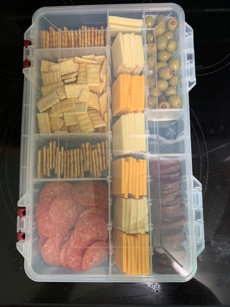 I used a new tackle box and washed it. Then added our favorite sliced cheeses, crackers and meat. I then lined one section with a paper towel and added olives. Lake Snacks, Vacation Snacks, Boat Snacks, Beach Snacks, Camping Snacks, Road Trip Food, Boat Food Ideas, Vacation Meals, Road Trip Snacks