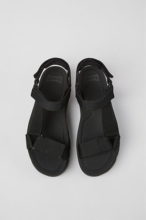 Our Oruga Up sandals were designed for summer days and boast a thick characteristic sole for more height and a unique look. Content + Care -Upper:95 % Fabric Printed finish (100% Recycled PET) 5 % Cow Leather -Outsole/Features: 100% EVA -Lining: No lining, 68 % Textile (60% Nylon - 40% PU) 28 % Textile ACABADODO PRINT (100% Recycled PET) 4 % Cow Leather, Non removable footbed -Lightweight -Flexibility -Easy-Fit -Imported Size -Runs small, size up. | Camper Oruga Up Sandal in Black, Women's at Urban Outfitters Camper Sandals, Camper Store, Print Finishes, Black Fits, Scandal, Cow Leather, Summer Days, Urban Outfitters, Printing On Fabric