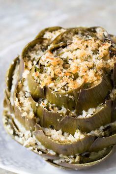 Stuffed artichokes are a perfect artichoke appetizer! Globe artichokes are trimmed and stuffed with herbed parmesan breadcrumb stuffing, then baked. On SimplyRecipes.com Artichoke Appetizer, Artichoke Recipe, Tartiflette Recipe, Stuffed Artichokes, Impressive Appetizers, Roasted Artichoke, Artichoke Recipes, Italian Appetizers, Easter Dinner