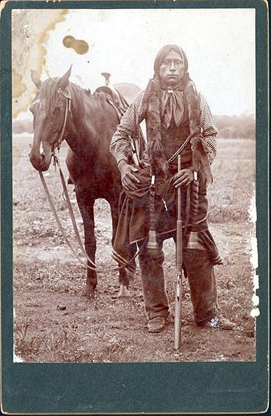 Winter dress [Young Comanche man with horse and western saddle] Cabinet card photograph George A. Addison, Fort Sill, Oklahoma Territory, ca. 1895 Comanche Indians, Quanah Parker, Foto Langka, American Indian History, Native American Images, Native American Men, Wilde Westen, Native American Pictures, Native American Beauty