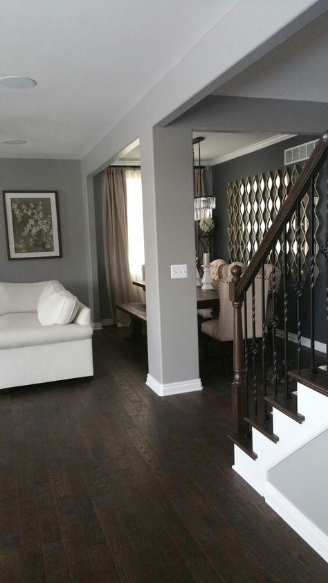 Gray walls and dark wood floors. Dark Wood Floors And Grey Walls, Dark Wood Floor Grey Walls, Brown Floors Grey Walls Living Rooms, Gray Walls With Hardwood Floors, Gray And Dark Wood Living Room, Grey Walls With Dark Wood Floors, Brown Wood Floors With Gray Walls, Dark Wood With Grey Walls, Floor For Grey Walls