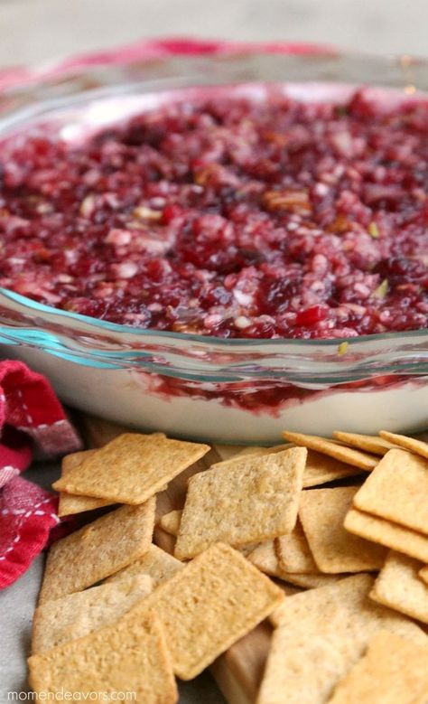 Cranberry Cream Cheese Dip is a festive and tasty appetizer for the holiday season. It's an easy to make dip that can be made with either fresh or canned cranberries, cream cheese, sugar and your favorite spices like cinnamon or nutmeg. Enjoy it as a dip for crackers, breads, chips or vegetables! Thanksgiving Potluck Ideas For Work, Potluck Ideas For Work, Thanksgiving Potluck Ideas, Christmas Party Dips, Dips And Appetizers, Christmas Cookie Dough, Cranberry Cream Cheese Dip, Cranberry Dip, Christmas Dip