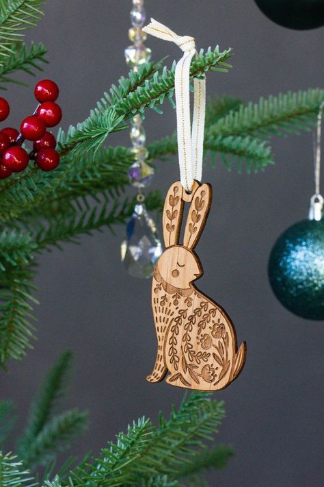 Welcome the winter season with delightful rabbit-themed decorations. Explore folk art ornaments, Glowforge ideas, and unique wooden ties that celebrate the magic of December! Rabbit Folk, December Art, Rabbit 2023, Folk Art Ornament, Glowforge Ideas, Laser Cut Christmas, Wood Tie, Xmas 2022, Folk Art Decor