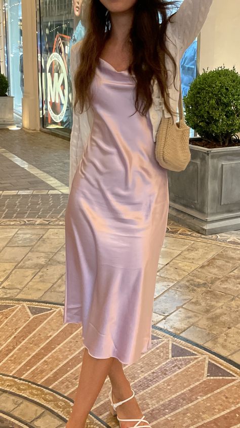 Silk dress with a crochet bag and claw clip in Los Angeles Aesthetic Birthday Party Outfits, Pink Silk Midi Dress, Pink Slip Dress Aesthetic, Pink Silk Long Dress, Pink Dress For Graduation, Pastel Silk Dress, Prom Dress With Cardigan, Pale Pink Dress Outfit, Silk Dress Hoco