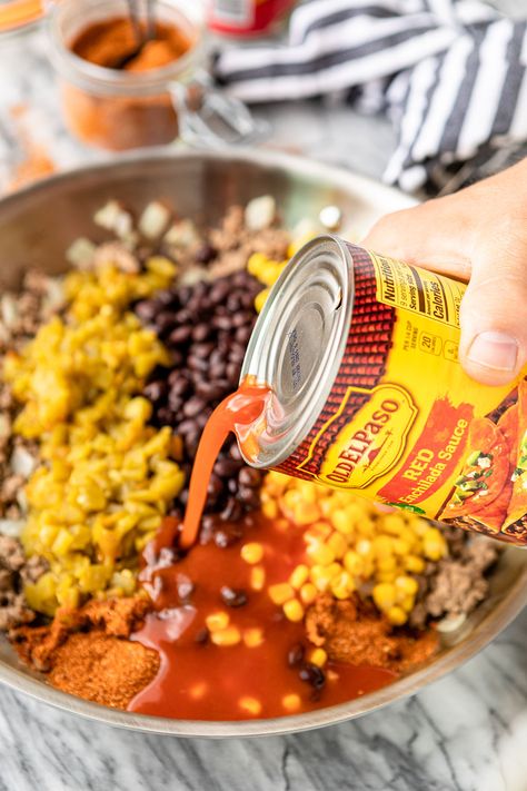 Cheesy Mexican Taco Tater Tot Casserole -- give this yummy taco tater tot casserole a try for your next Taco Tuesday! Taco-spiced saucy ground beef, canned black beans & corn, all topped off with crispy tater tots and cheese makes for an easy family-favorite dinner. #cansforcomfort #easyrecipe #casserole #casserolerecipes #casserolerecipeseasy #tatertots #tatertotcasserole #tacocasserole #tacotuesday #mexicancasserole Gator Tot Taco Casserole, Taco Casserole Bake With Tator Tots, Southwest Tater Tot Casserole, Taco Bake With Tater Tots, Taco Tator Casserole, Tator Tot Taco Bake, Tatter Tots Casserole Taco, Enchilada Tater Tot Casserole, Taco Tatertot Casserole Recipe Beef