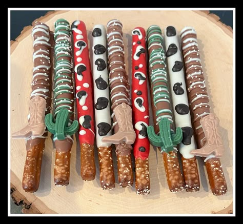 We will only be accepting orders for March 1st delivery and forward. We can not accommodate orders prior to March 1st.... they will be refunded if placed for delivery prior. We appreciate your business and understanding!  Western themed chocolate covered pretzels, individually wrapped and ribboned! You can specify colors desired as well!   Absolutely delicious, these cute and unique themed treats are the perfect addition to your next event!  Thanks for your interest, happy shopping! *Made in a facility that also uses peanuts* Rodeo Party Snack Ideas, Western Chocolate Covered Pretzels, Rodeo Treats Western Theme, Rodeo Theme Dessert Table, My First Rodeo Snack Table, Western 25th Birthday, Rodeo Dessert Ideas, Western Theme Dessert Table, Ranch Themed Party