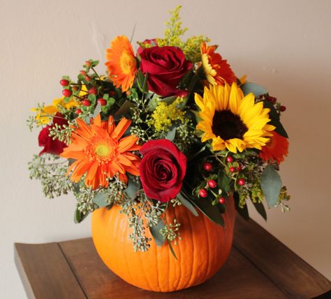 pumpkin and flower centerpieces | Our gorgeous new portfolio book just appeared and we cannot stop ... Veselý Halloween, Pumpkin Bouquet, Fall Flower Arrangements, Fall Floral Arrangements, Pumpkin Flower, Fall Arrangements, Pumpkin Centerpieces, Fall Wedding Flowers, Deco Floral