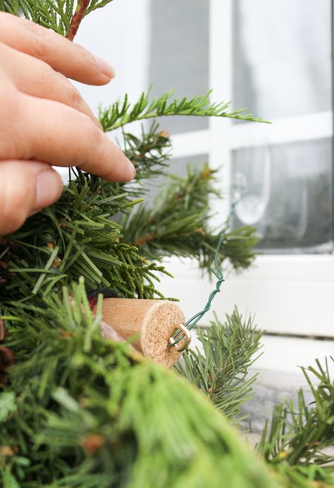 A Garland Hack and How to Make and Hang Window Christmas Swag Outdoor Window Swags For Christmas, Window Garland Christmas Outdoor, Hanging Outdoor Decor Ideas, Christmas Window Swags Outdoor Diy, Diy Window Swag Christmas, How To Hang Garland Over Window, Garland Around Window Christmas, Garland Around Window Outside, Window Swags Christmas