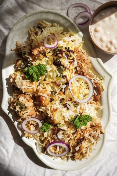 Vegan Biryani Mughlai Style Rice Mixed Vegetables, Vegan Biryani, Veg Biryani, Plant Based Yogurt, Biryani Recipe, Red Chili Powder, Cooked Veggies, Aromatic Herbs, Spices And Herbs