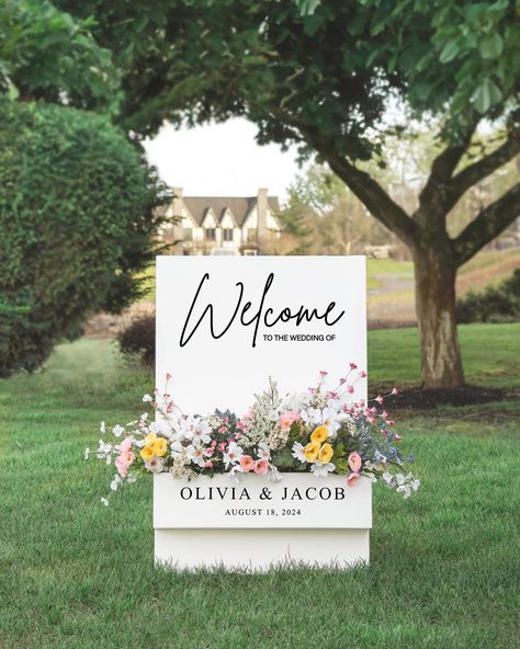 Warmly welcome your guests with our elegant, handmade Flower Box Welcome Sign. Make a memorable first impression with this beautiful and unique greeting accessory.  Dimensions: - Sign Width: 24 inches - Sign Height: 36 inches - Flower Box Outside Dimensions: 24x6x4 - Flower Box Inside Dimensions: 23.5 x 5.5 x 3.5  This listing is for the one flower box sign. No other decor is included. Matching Seating Chart: https://www.etsy.com/listing/1698850951/wedding-seating-chart-personalized *HI, AK, Pue Flower Wall Seating Chart Wedding, Welcome Sign Garden Wedding, Wedding Flower Box Sign, Wedding Welcome Flower Box Sign, Ceremony This Way Sign, Flower Welcome Sign Wedding, Welcome Wedding Sign With Flowers, August Wedding Decorations, Wedding Welcome Sign Mirror With Flowers