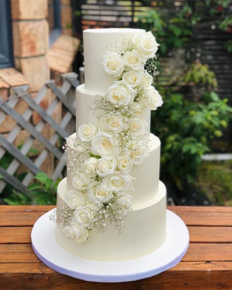 White Cakes Wedding, Simple White Wedding Cake With Flowers, White Roses On Wedding Cake, 4 Tier Wedding Cake With Flowers Elegant, Classic Wedding Cake With Flowers, Three Tiered Wedding Cake With Flowers, White Rose Cake Wedding, Simple 3 Tier Wedding Cake With Flowers, White Wedding Cake With White Flowers