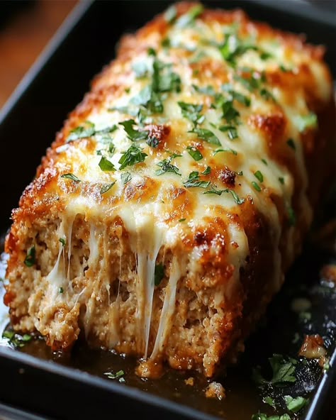 Try this Golden-Baked Parmesan Chicken Meatloaf with a mozzarella crust. Delicious, easy to make, and perfect for a family dinner. Chicken And Pork Meatloaf, Crowd Lunch Ideas, Garlic Chicken Meatloaf, Breaded Parmesan Chicken, Garlic Parm Chicken Meatloaf, Parmesan Chicken Meatloaf, Healthy Mozzarella Recipes, Italian Dinner For A Crowd, Chicken Parm Meatloaf