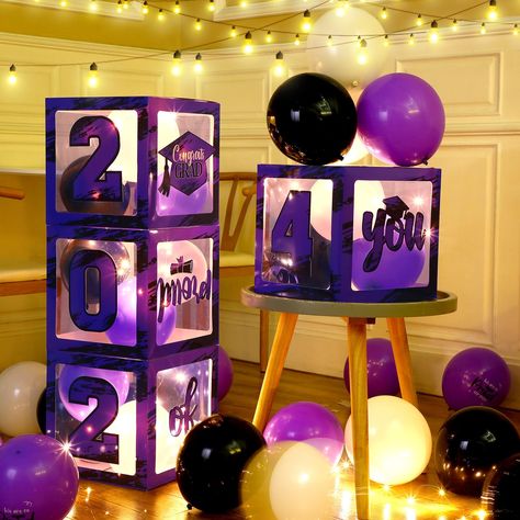 PRICES MAY VARY. Novel Graduation Design: these proud of you balloon boxes are designed with fashionable watercolor purple and black backgrounds, and decorated with classic graduation element LED light string lights, such as a graduation cap, [2024], [Proud of you], and more Grad Party Box Set: you will receive 4 purple and black transparent grad theme boxes decoration, and 8 pieces of decorative cardboard, including [proud], [of], [you], [2], [0], [2], [4], and a shape of graduation hat, 18 lat Purple Black And Silver Graduation Party, Purple Graduation Party Ideas, Purple Graduation Party, Boxes Decoration, 2025 Graduation, Grad Decor, Balloon Boxes, Graduate Party, Box Decorations