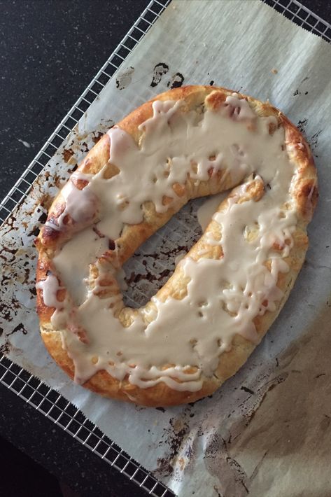 A top view of a Danish Kringle on a cooling rack. Kringle Recipe, Danish Kringle, Racine Wisconsin, Danish Pastry, Family Eating, Dessert Ingredients, Pastry Blender, Serious Eats, Cinnamon Buns