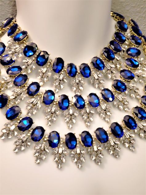 "Hello, welcome to Ken's Closet Today we have a beautiful 3 strand Blue Saphire and Diamond Clear Crystal Necklace. The crystals are set in gold metal, they really bring out the color. Large crystals are accented by smaller Clear crystals. The necklace is appx 18\" long total. The hang is appx 5\" from the center top stand to the bottom 3rd strand. Crystals are imitation and not genuine crystals" Real Silver Necklace, Blue Diamond Necklace, Gold Statement Jewelry, Diamond Drop Pendant, Clear Crystal Necklace, Queen Jewelry, Diamond Jewelry Designs, Crystal Diamond, Expensive Jewelry