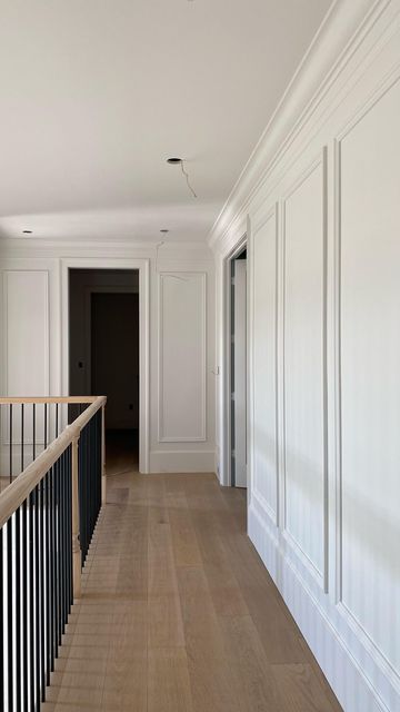 Modern Farmhouse Moulding, Hallway Transitions Interior Design, Family Room Trim Ideas, Two Story Picture Frame Molding, Wall In The Middle Of Living Room, Wainscoting Ideas Hallway Entry Hall, Wall Trim High Ceiling, Trimwork On Walls, 2 Story Foyer Molding Ideas