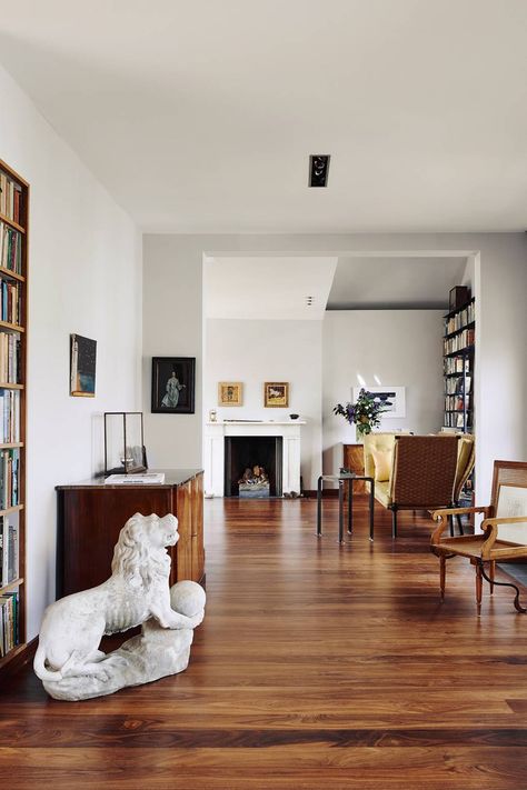 The living room in [link url="http://www.houseandgarden.co.uk/interiors/real-homes/charles-rutherfoords-elegant-london-house"]Charles Rutherford's London home[/link] is decorated in a simple, elegant style with white walls and wooden floors. The desgin reflects current architectural ideas surrounding the play of light and flow of space. Instead of architectural mouldings, there are shadow gaps at the top of walls painted a shade of luminous blue-grey. Dark Wood Living Room, Wooden Floors Living Room, White Walls Living Room, Living Room Units, Dread Locks, Living Room Wood Floor, Room Furniture Design, Flooring Inspiration, Furniture Design Living Room