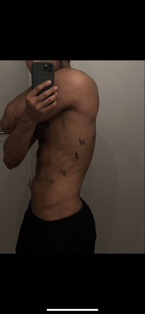 Bird tattoo Bird Side Tattoo Men, Mens Birds Tattoo, Birds On Side Tattoo Men, Small Tattoos For Men Birds, Birds On Ribs Tattoo Men, Tattoo Designs Men Aesthetic, Bird Tattoo On Stomach, Birds Going Up Arm Tattoo, Men’s Bird Tattoo Arm