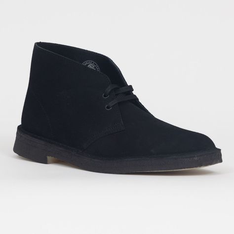 CLARKS ORIGINALS Desert Boot in BLACK SUEDE CLARKS ORIGINALS Desert Boot in BLACK SUEDE Cultural cachet and design DNA: no shoe is quite like the Clarks Originals Desert Boot. Nathan Clark’s 1950 design was inspired by a rough boot from Cairo’s Old Bazaar, and its minimal, progressive style sparked a worldwide footwear revolution. Every design detail today remains true to that first pioneering pair. The authentic, sustainably sourced crepe sole completes this distinctive silhouette. Instantly re Desert Clarks, Clark Boots, Black Clarks, Clarks Originals Desert Boot, Desert Boot, Clarks Originals, Desert Boots, Cairo, Black Suede