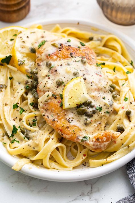 Creamy lemon chicken piccata is a delicious 30-minute meal with lightly breaded chicken breasts smothered in a garlic and caper cream sauce. Lemon Butter Caper Chicken, Lemon Chicken Piccata Recipe With Capers, Easy Chicken Piccata Recipe Simple, Chicken Lemon Capers Recipe, Creamy Lemon Caper Sauce, Cheesecake Factory Chicken Piccata, Chicken With Capers And Lemon, Chicken Capers Lemon Piccata, Lemon Chicken Capers