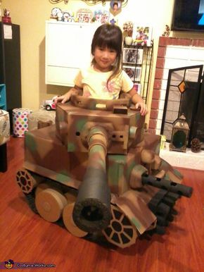 Alex: This cutest Tiger tank is made of 100% used material such as cardboard boxes, kitchen paper towel roll, mail shipping tubes, packaging form, packaging air bag for tracks and used... Cardboard Tank Diy, Cardboard Tank, Tank Costume, Homemade Costumes For Kids, Transformer Costume, Chair Wheels, Cardboard Fireplace, Cardboard Costume, Cardboard Playhouse