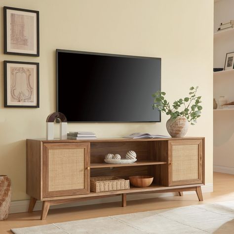 PRICES MAY VARY. 【𝑺𝒂𝒗𝒆 𝒔𝒑𝒂𝒄𝒆】: The TV stand comes with 2 side cabinets and an open cubby. Each section features removable and adjustable shelves so you can customize your storage to suit your needs. Provides ample storage space for media, electronics, books, and other items. There are three large cable holes on the back for easy wire feeding and ventilation of audio-video equipment. 【𝑨𝒓𝒕 𝑺𝒕𝒚𝒍𝒆 𝑪𝒐𝒍𝒍𝒊𝒔𝒊𝒐𝒏】: The collision of mid-century modern and boho styles makes it an a Rattan Tv Stand, Rattan Door, Media Console Table, Modern Entertainment Center, Farmhouse Tv Stand, Mobile Tv, Timeless Aesthetic, Cabinet Features, Modern Tv Stand