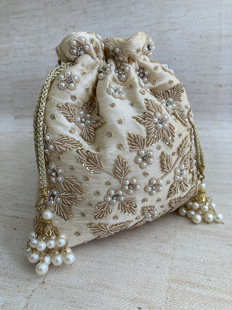 Introducing Simran our gorgeous potli bag with intricate handcrafted zardozi work and pearl detailing finished off with a pearl handle. A definite statement piece and show stopper. Pakistani Jewellery, Embroidery Purse, Handcrafted Handbags, Wrist Chain, Kawaii Bag, Zardozi Work, Creative Wedding Gifts, Potli Bag, Women's Bags By Shape