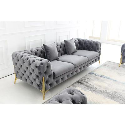 Both inviting and elegant, this sofa encourages lingering and long conversations. An eye-catching piece that adds a luxe look and feel to your living room. Plush velvet upholstery offers an elegant look, button-tufting adding a trendy touch. Gold metal legs peak out underneath for a sleek design. Fabric: Gray Velvet | Everly Quinn Johnitta Velvet in Gray, Size 27.5 H x 96.0 W x 37.0 D in | Wayfair Mink Velvet Sofa Living Rooms, Mink Crushed Velvet Sofa Living Rooms, Crushed Velvet Sofa Living Rooms, Formal Living Room Designs, Sofa Blue, Sofa Gray, Tufted Loveseat, Sofa Velvet, Modern Sofa Living Room