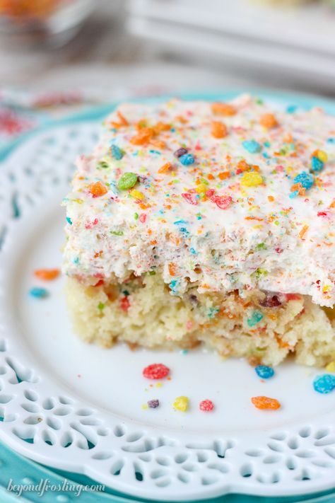 This Fruity Pebble Cereal Milk Poke Cake is a Fruity Pebble filled vanilla cake, soaked in sweetened condensed milk and topped with a Fruity Pebble Whipped Cream. Fruity Pebble Cake, Fruity Pebbles Cake, Pebbles Cake, Fruity Pebble Cheesecake, Pear And Almond Cake, Fruity Pebble, Fruity Pebbles Cereal, Pebbles Cereal, Cake Mix Ingredients