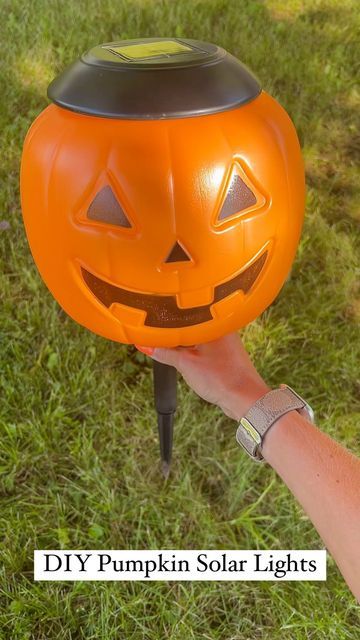 Plastic Pumpkin Over Solar Lights, Lighted Pumpkins On Porch, Pumpkins With Lights, Pumpkin Lights Outside, Pumpkin Bucket Solar Lights, Diy Pumpkin Bucket Decor, Plastic Pumkin Decoration Ideas Easy, Diy Pumpkin Pathway Lights, Halloween Plastic Pumpkin Ideas