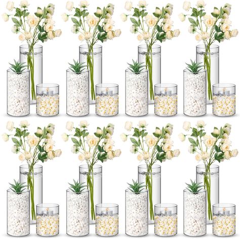 PRICES MAY VARY. Abundant Quantity: with 24 clear cylinder vases included in the package, you'll have an ample supply for your floral arrangements or decorative displays; Whether you're organizing a large event or simply enjoy regularly refreshing your room decor, this set provides the quantity you need to effortlessly adorn multiple spaces Quality Material and Dishwasher Safe: crafted from quality plastic, these clear plastic vases are not only sturdy but also dishwasher safe, ensuring easy maintenance and long lasting use; The construction provides that you can confidently display your favorite blooms or candles without worrying about fragility; And they can be filled with liquids, gems, rose petals and more small items; Note: do not point the flame at the bottle Versatile Sizes: the pil Birthday Centerpiece Ideas, Cylinder Centerpieces, Vases For Centerpieces, Office Party Decorations, Plastic Vase, Glass Cylinder Vases, Tall Candle Holders, Birthday Centerpieces, Dinner Decoration