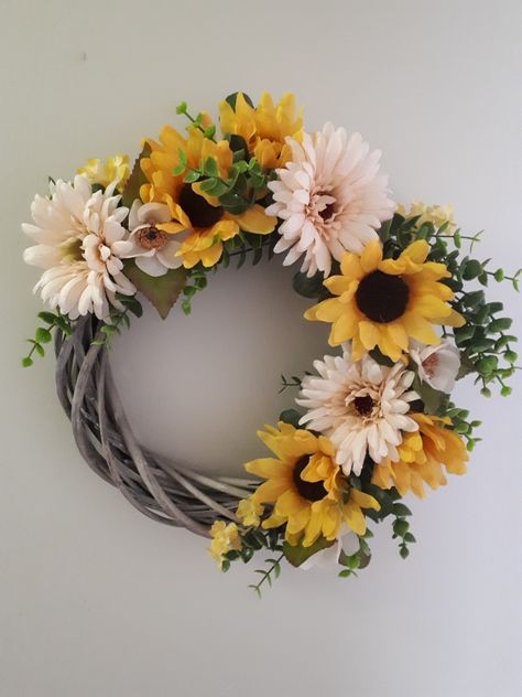 Sunflowers, Gerbera Daisies and Anemones look bright and cheerful on a 12 inch bamboo wreath. Bamboo Wreath Ideas, Bamboo Wreaths, Bamboo Wreath, Loose Watercolor Flowers, Holiday Wreaths Diy, Wildflower Wreath, Summer Decorations, Gerbera Daisies, Loose Watercolor