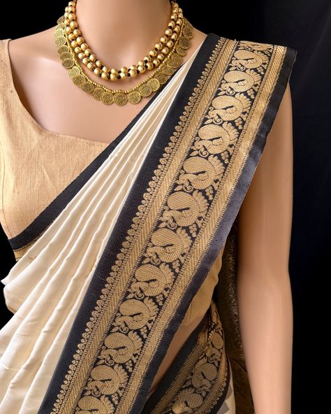 Off white art silk saree with beautiful Black peacock zari and temple border. Comes with contrast grey black pallu and blouse. Wash care: Normal wash. Find this saree in website: Www.thejacouture.in > Silk sarees > off white art silk saree. Jewellery: @anvi__jewellery #artsilksaree #whitesaree #silksaree #traditional #sareelove #softsilksaree #blackbordersaree #offwhitesaree Silk Saree Jewellery, Off White Saree, Black Peacock, Saree Jewellery, White Saree, Art Silk Sarees, Soft Silk Sarees, White Art, Silk Saree