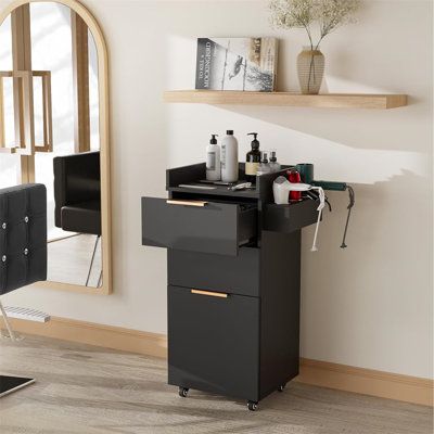 The pull-out side tray has three metal tool holders, so you can put hot tools with no worries like a curling iron, straightener, and hair dryer. Three ample storage drawers: Including three drawers, 10.3''X12.6''X4.9'', the hair cart is perfect for storing hair salon equipment and styling appliances, such as waxing equipment, esthetician supplies, hair extensions, and more. Flat-top working space make it convenient for stylist to keep essential tools close at hand. Mobile salon station: Enjoy large storage and multi-purpose rolling cart mobility around your salon, spa, or beauty business with the durable salon trolley cart. Four smooth-glide wheels allow for effortless mobility around your salon, spa, or barbershop. Two wheels are lockable to avoid the cabinet sliding around when you do ha Salon Wall Cabinets, Portable Hair Station, Hair Salon Furniture Ideas, Small Salon Station, Salon Suite Small Spaces, Salon Suite Door, Small Home Hair Salon, Hair Salon Studio Decor, Hair Suite Ideas