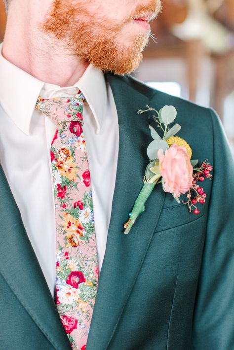 Jack decided to ditch the classic black tie and opt for one that was covered in the flowers that were a part of the rest of their wedding. Follow our social media for more of Katie and Jack's dreamy wildflower wedding! IG: @maurajanesphoto | Website: maurajanephotography.com Colorful Wedding Outfit Men, Groom Floral Shirt, Whimsical Groomsmen Attire, Groom Attire Garden Wedding, Wildflower Wedding Groom Suit, Men’s Wedding Looks, Colorful Wedding Suits Men, Wildflower Wedding Suit, Floral Groom Suit