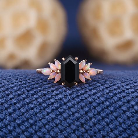 Unique Long Hexagon Cut Black Onyx Engagement Ring Rose Gold Opal Cluster Wedding Ring Dainty Black Gemstone Rings Anniversary Gift For Her Jewelry Information: ♡ Handmade, high-quality item ♡ Material: SOLID 14K/18K GOLD ( can be made in yellow/white/rose gold ) ♡ Center stone: black onyx ♡ Size/Weight:  5x9mm ♡ Cut - Long Hexagon Cut ♡ Side stone: Natural opal ♡ Cut - Marquise Shaped ♡ Band Width: Around 1.8mm Visit my shop for more jewelry: https://www.etsy.com/shop/acraisejewelry PRODUCTION Opal And Onyx Engagement Ring, Unique Gemstone Rings, No Diamond Engagement Ring, Alt Wedding Rings, Dark Wedding Ring, Rose Gold Rings Engagement, Dark Engagement Ring, Gothic Engagement Rings, Non Traditional Wedding Rings