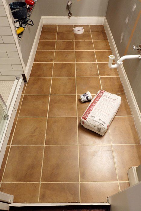 Looking to learn, experiment, and erase a tile floor quick, self-leveling concrete and brass inlays were the weapons of choice. So I finally finished redoing the master shower, right, so ugh, the floor was that much more noticeably awkward and unattractive. It had to go! And go now! But I was so tired of tiling....hm. What to do?I'll try some self-leveling concrete underlayment! Before I get too far into this, I should say that yes, I am aware this product is underlayment and n Cement Floor Bathroom, Concrete Tile Bathroom, Diy Concrete Tiles, Bathroom Concrete Floor, Tile Over Tile, Concrete Floors Diy, Cement Bathroom Floor, Cement Bathroom, Concrete Shower